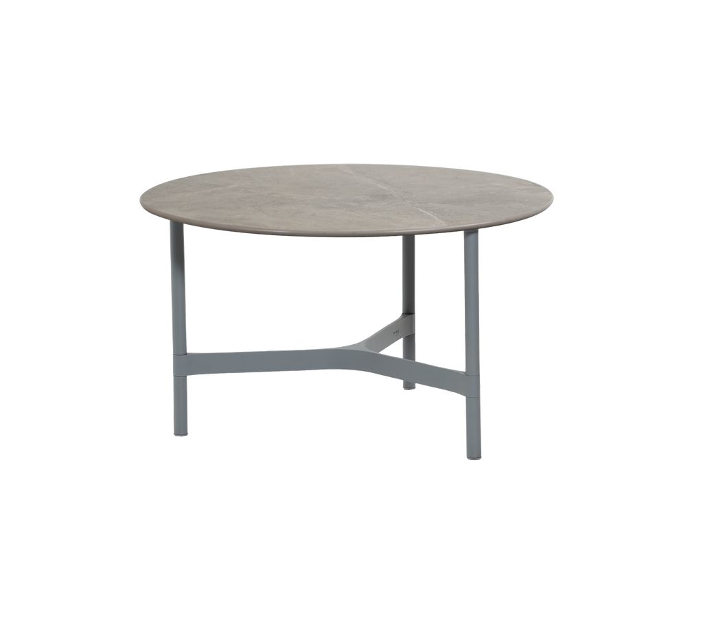 Round grey table with a light frame.