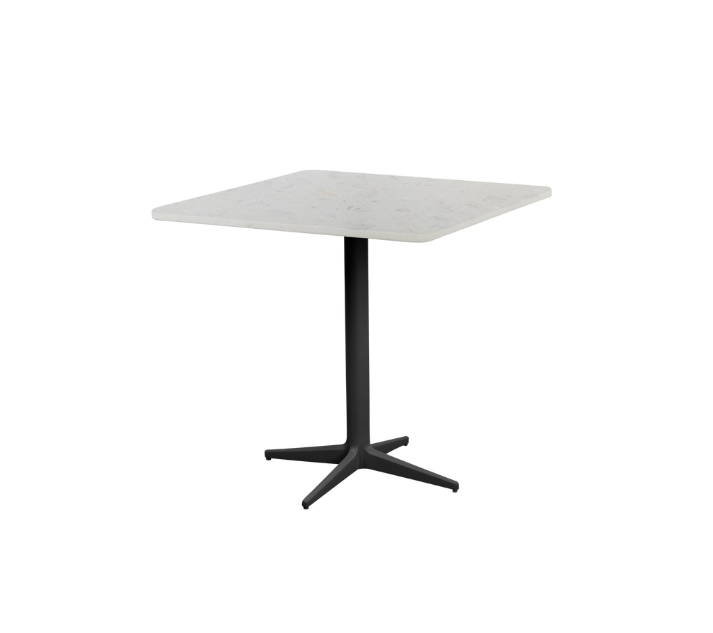 Modern square white table with a black base.