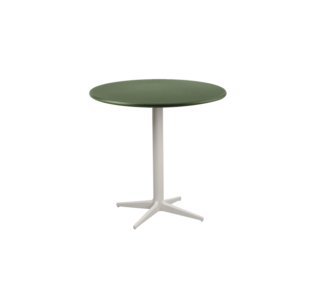 Round green table with a white base.
