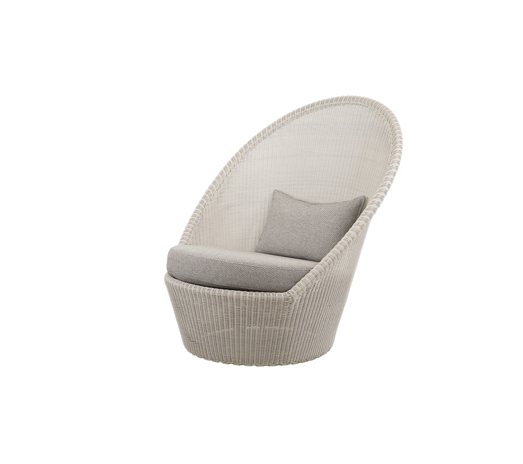 Light brown chair with sand-colored cushion in a modern lounge setting.