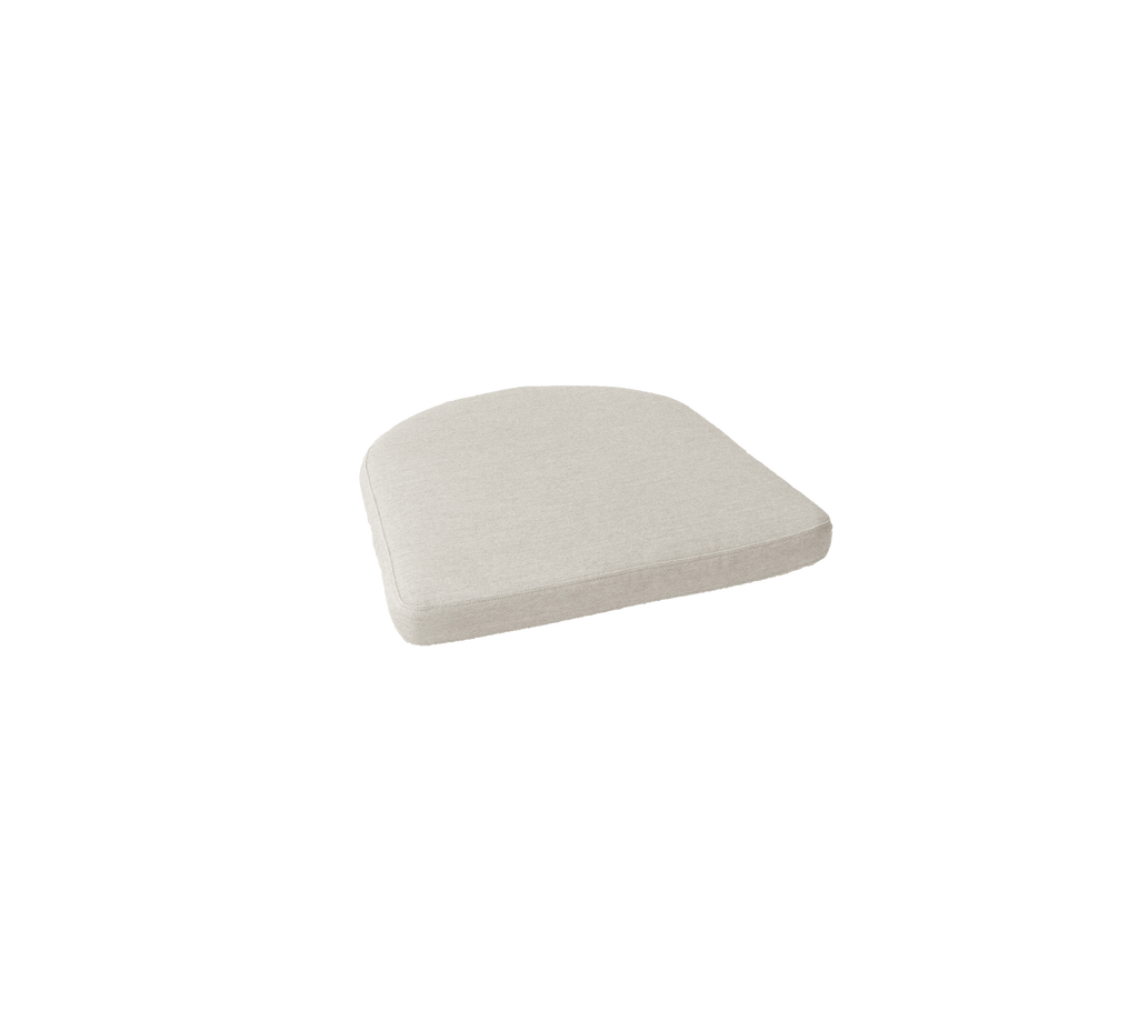 Sand cushion with curved shape and flat surface.
