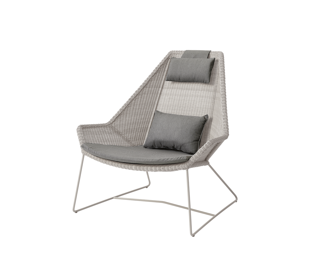 Modern grey chair with cushions in a contemporary lounge setting.