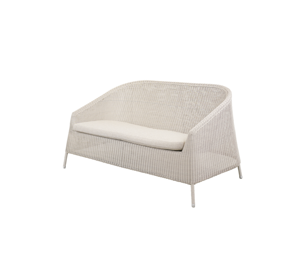 Modern sofa with a white cushion in a minimalist style.