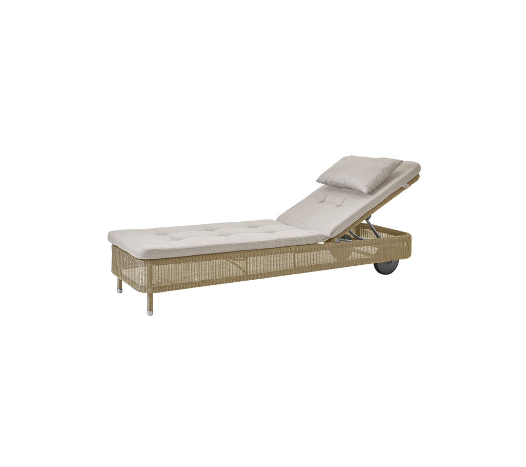 Minimalist lounge chair with sand-colored cushion.