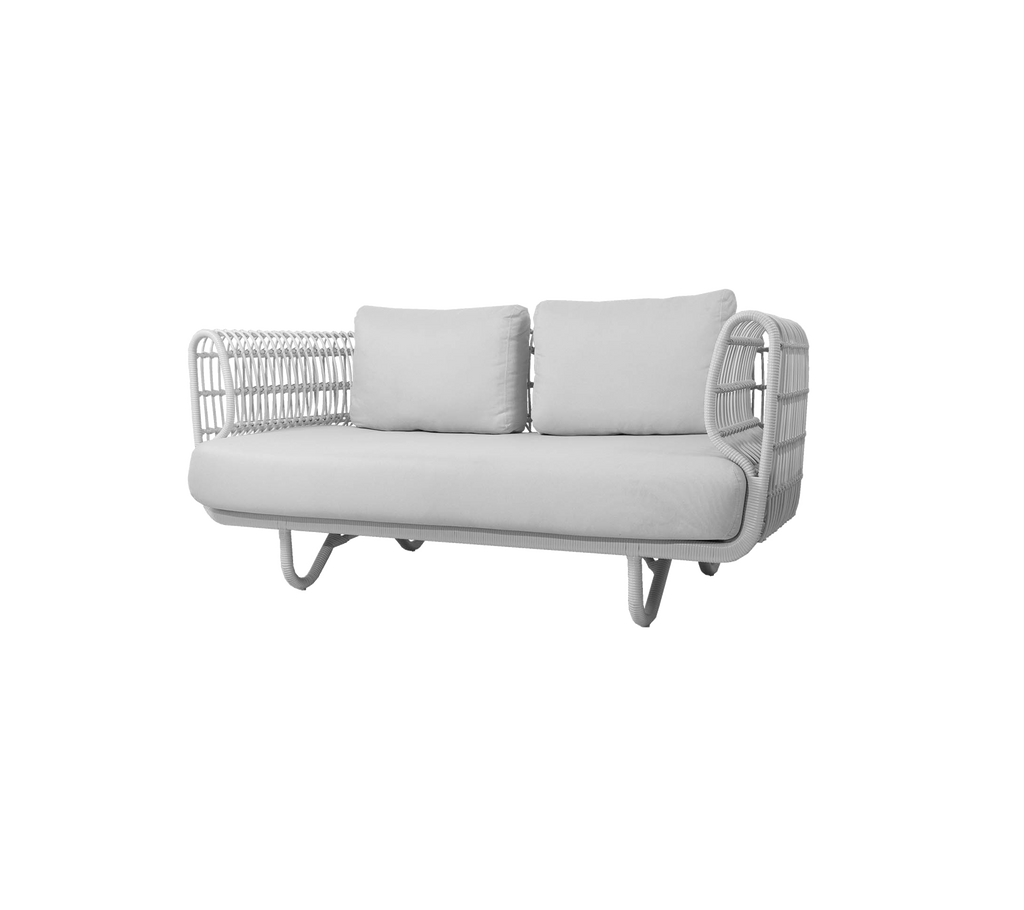 Stylish two-seat sofa with a sleek design, featuring soft cushions and decorative woven side arms in a neutral color scheme.