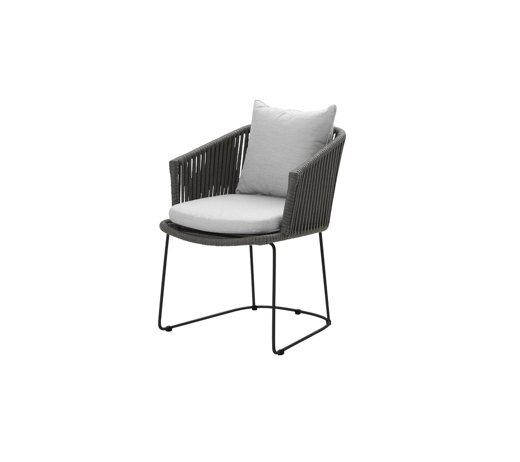 Modern outdoor chair with a dark frame, featuring a comfortable light gray cushion and a stylish design. Perfect for patios or gardens.