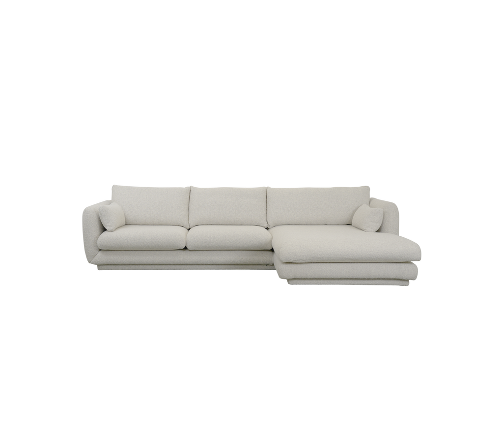 Modern sand sofa with clean lines and soft cushions.