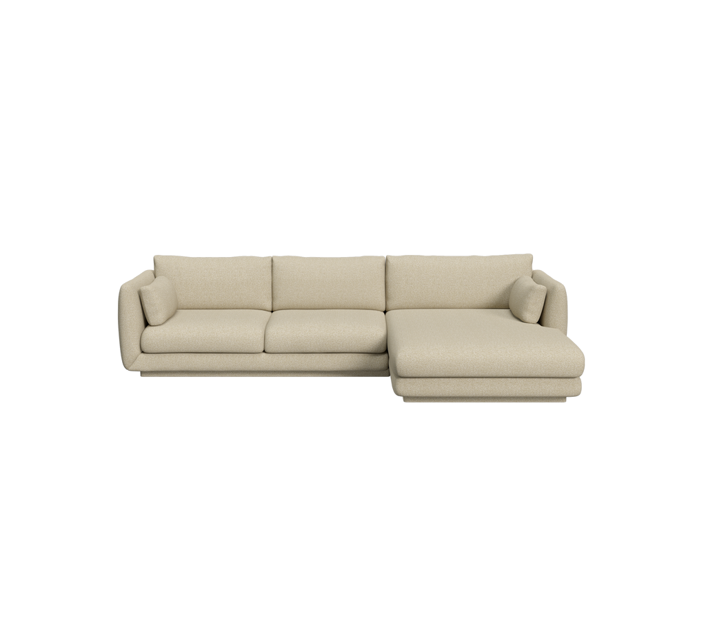 Light brown sectional sofa in a modern lounge setting.