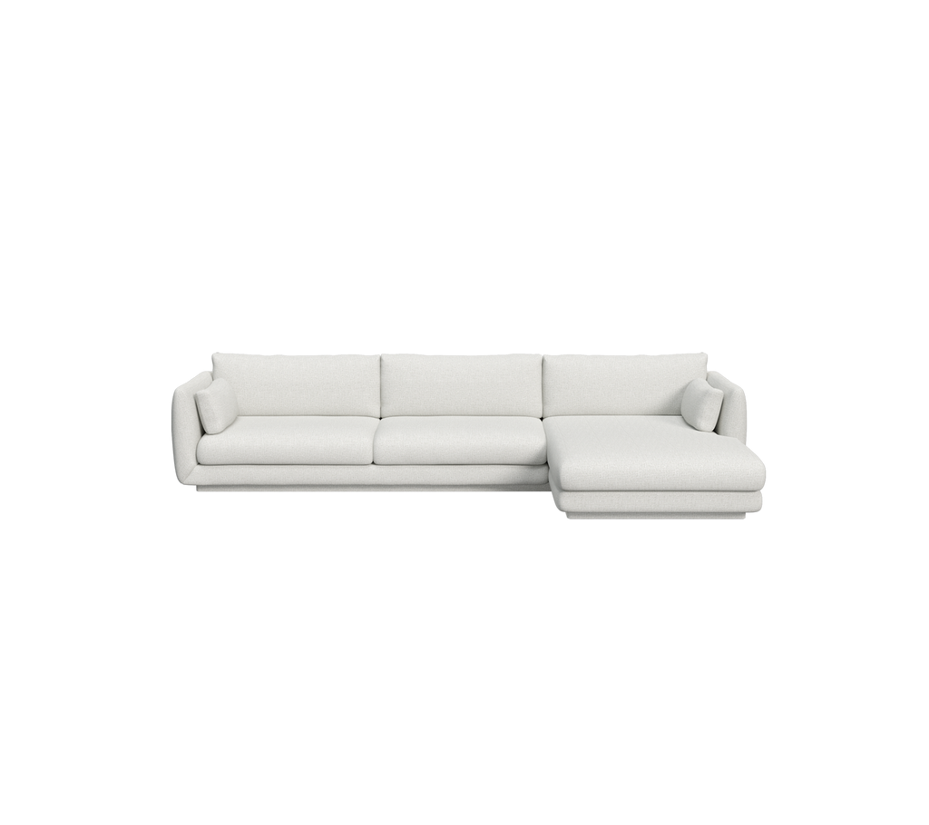 Light grey modern sofa with a sectional design.