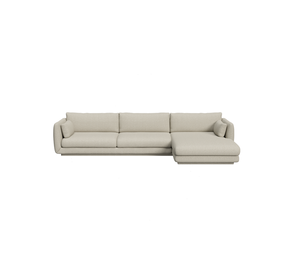 Light brown sectional sofa in a modern lounge setting.