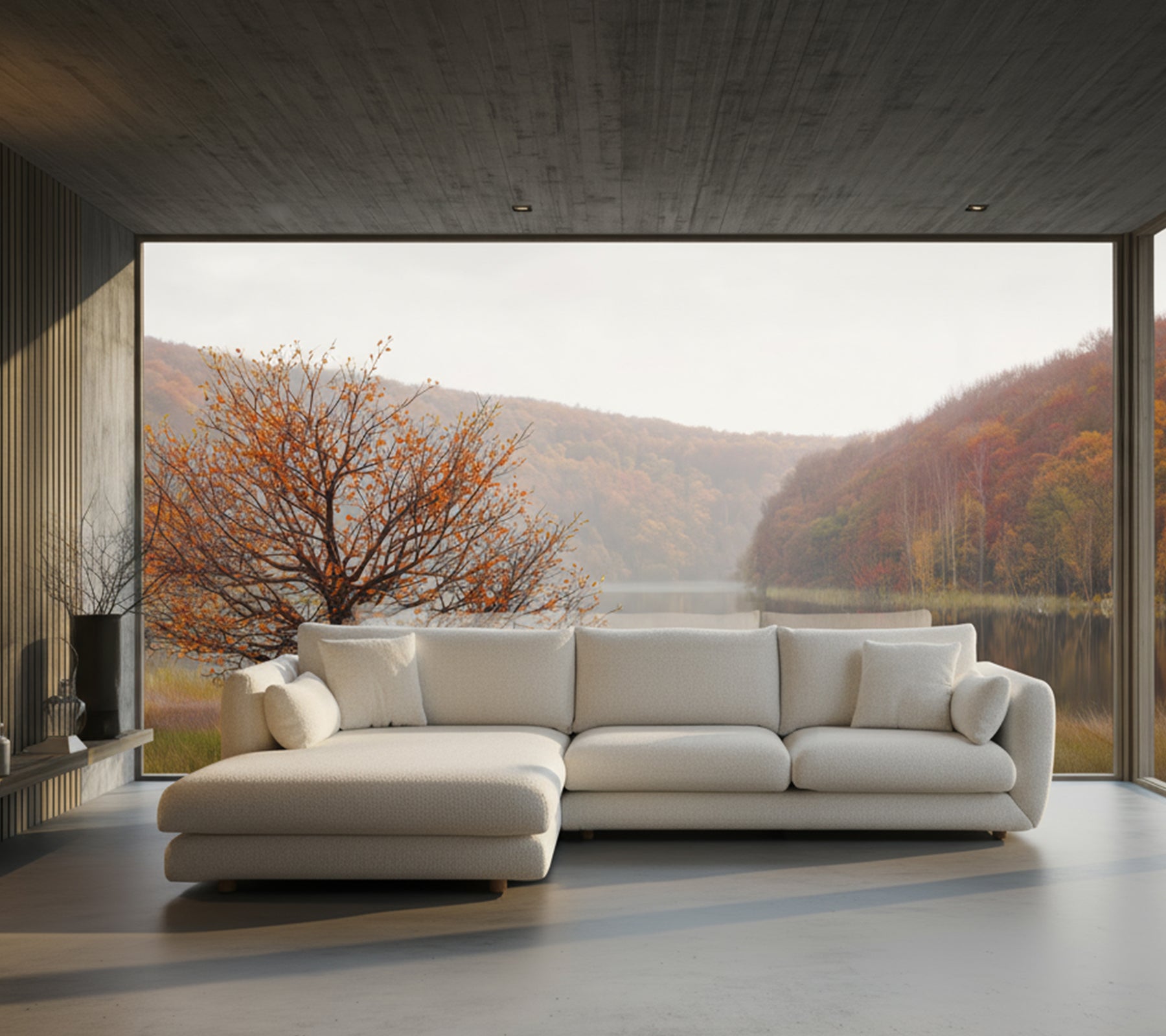Modern white sectional sofa in a living room with scenic view.