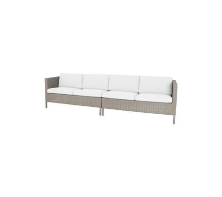 Stylish sofa with a woven base and plush white cushions, perfect for enhancing any dining space.
