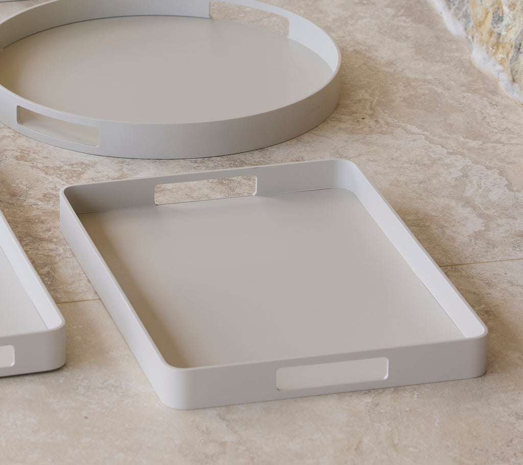 Rectangular club tray in a soft sand color, featuring cut-out handles for easy carrying, suitable for various displays and uses.
