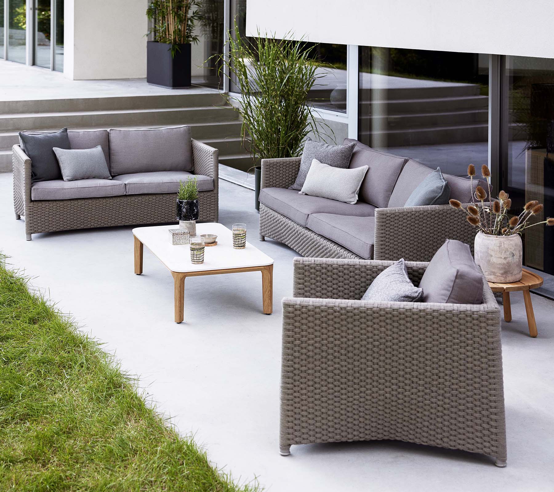 Stylish lounge area featuring a diamond 2-seater sofa, diamond 3-seater sofa, and a matching lounge chair, complemented by a coffee table.