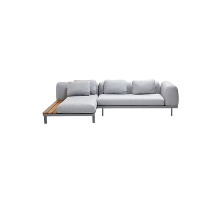 Light grey sectional sofa with plush cushions and a wooden armrest on one side, offering modern and comfortable seating.