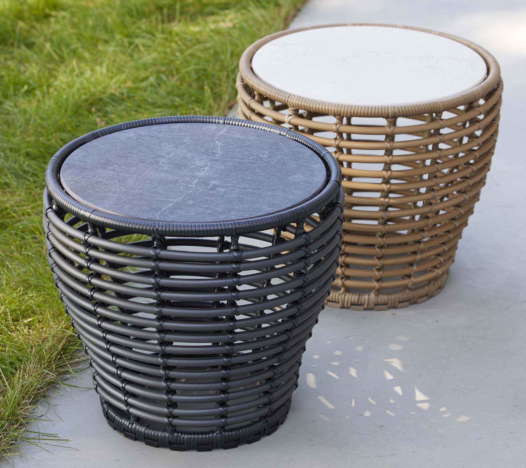 Two stylish basket coffee tables in contrasting colors, featuring woven designs and round tops. Ideal for adding a modern touch to any space.